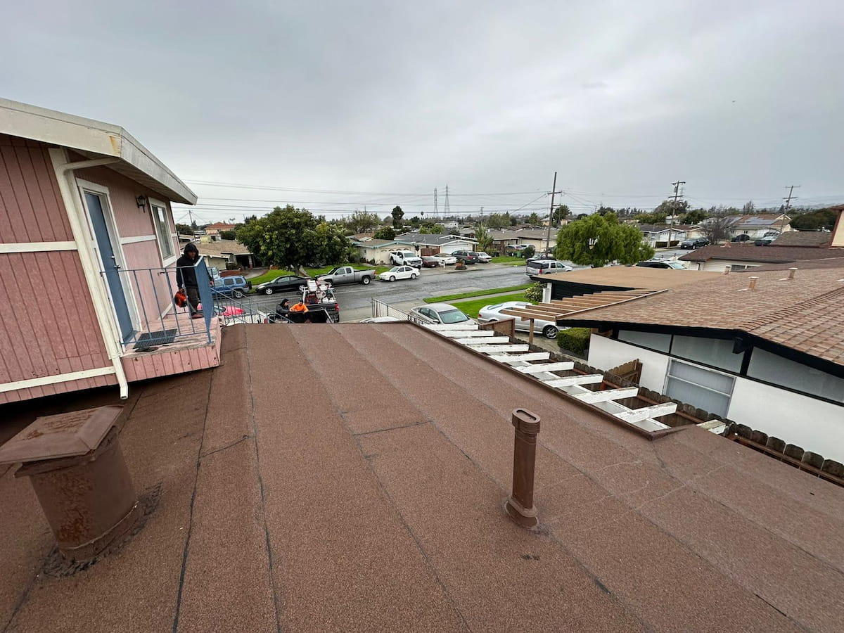 Roof repair work on a residential asphalt shingle roof